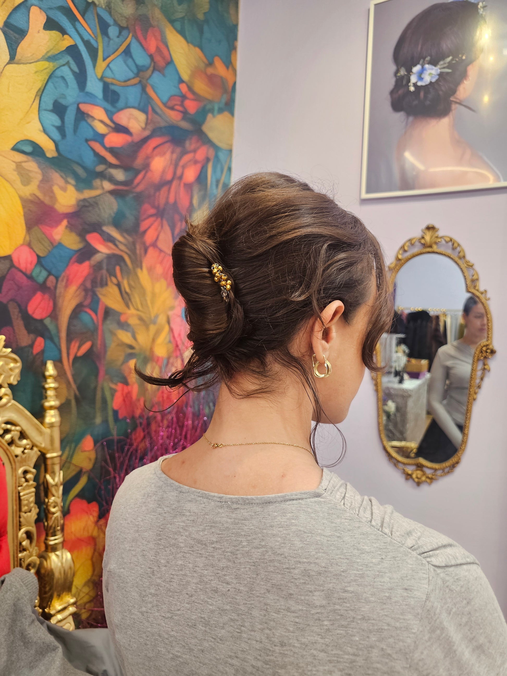 Woman with styled hair in JANZIUKA shop. 