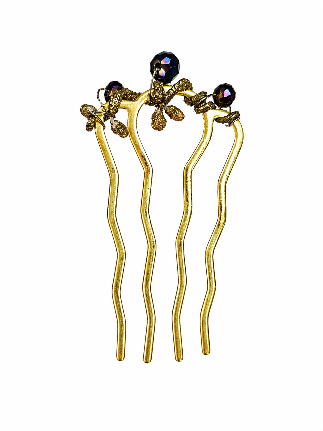 Gold hairpins with decorative elements on a white background