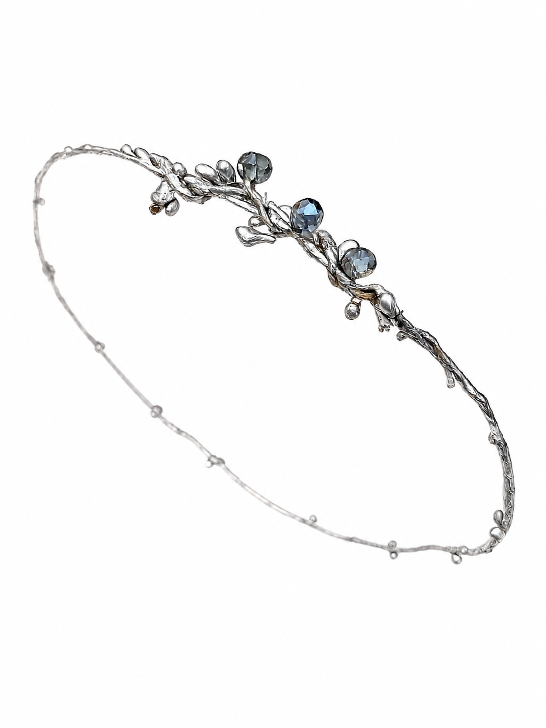 Silver headband with blue stones on a white background