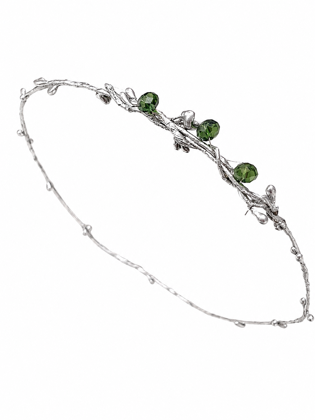 Silver bracelet with green gemstones on a white background