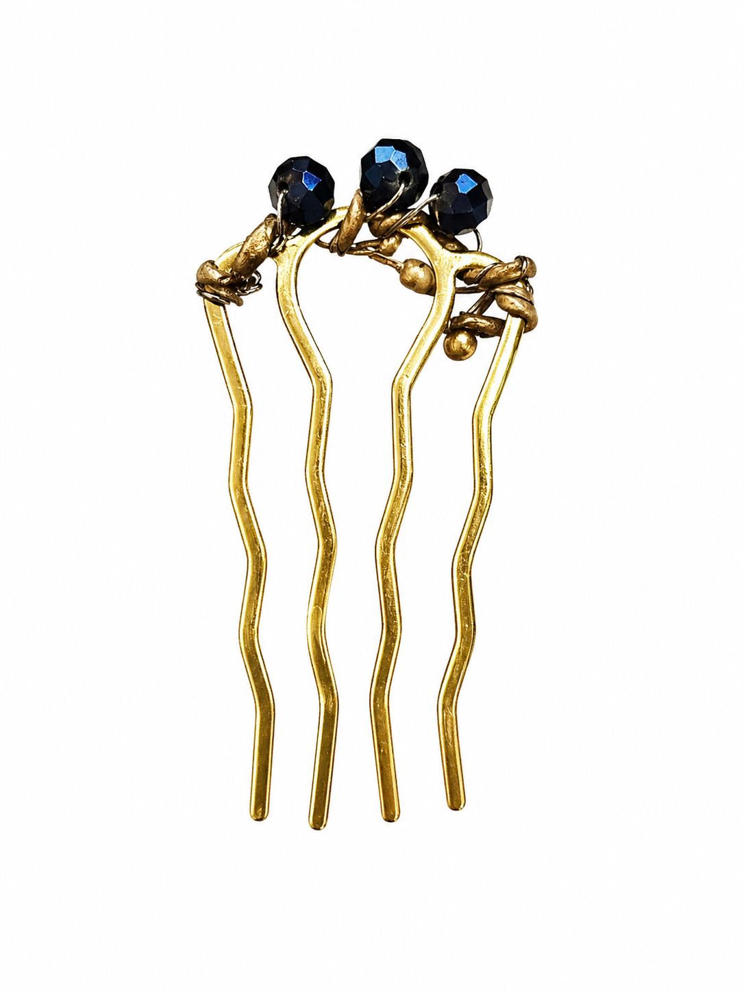 Gold hairpins with blue gemstones on a white background
